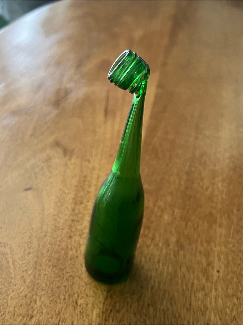 Vintage green glass bent neck bottle 6.5” mini novelty curio figurine